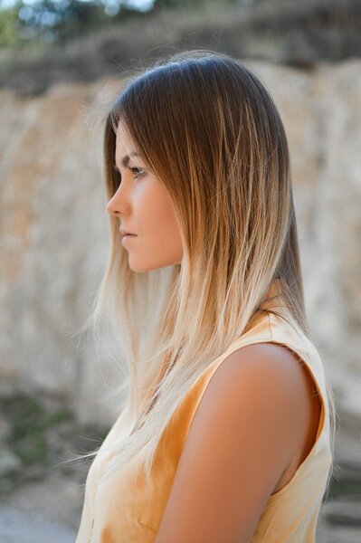 Blonde girl with hair colour growing out