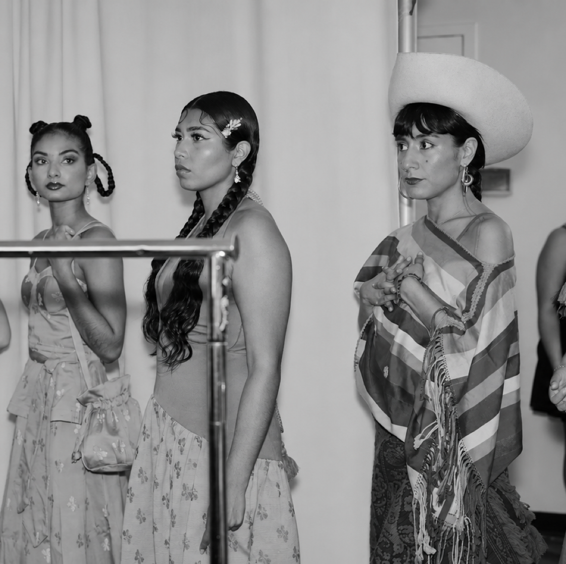 Models lined up backstage in monochrome at Fashion Week