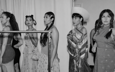 Models lined up backstage in monochrome at Fashion Week
